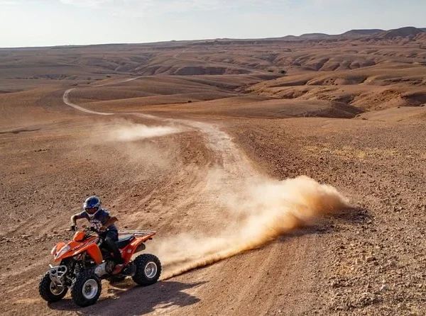 Agafay Desert packages quad riding on desert track near Marrakech